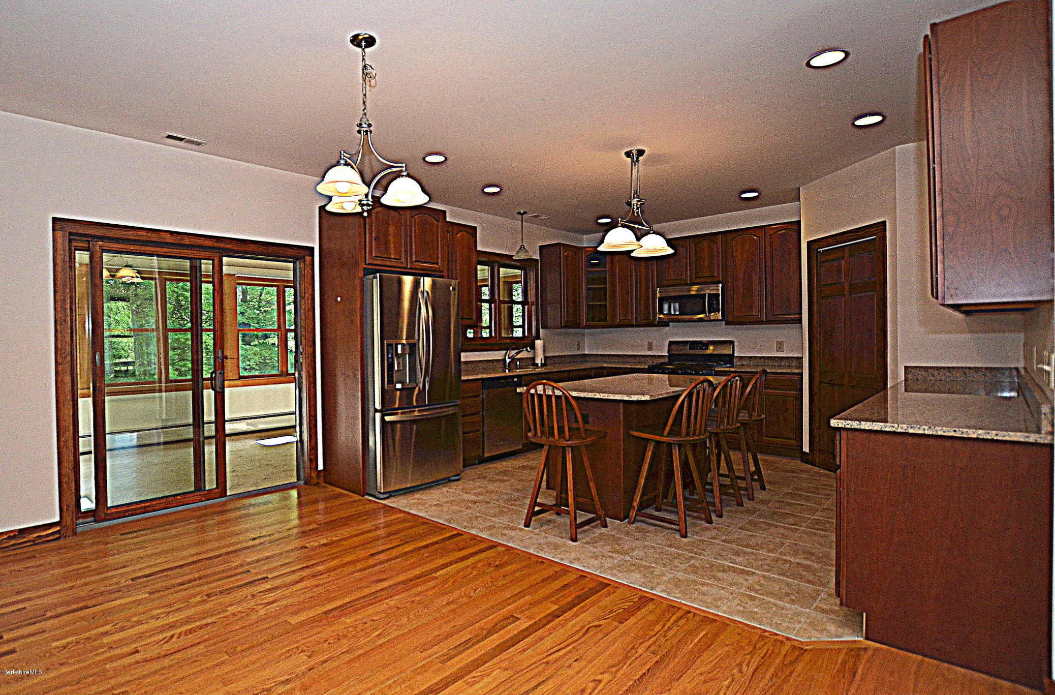 779 Stebbins Road Otis, MA 01253 - Photo 12 of 40 a view of a dining room with furniture window and wooden floor