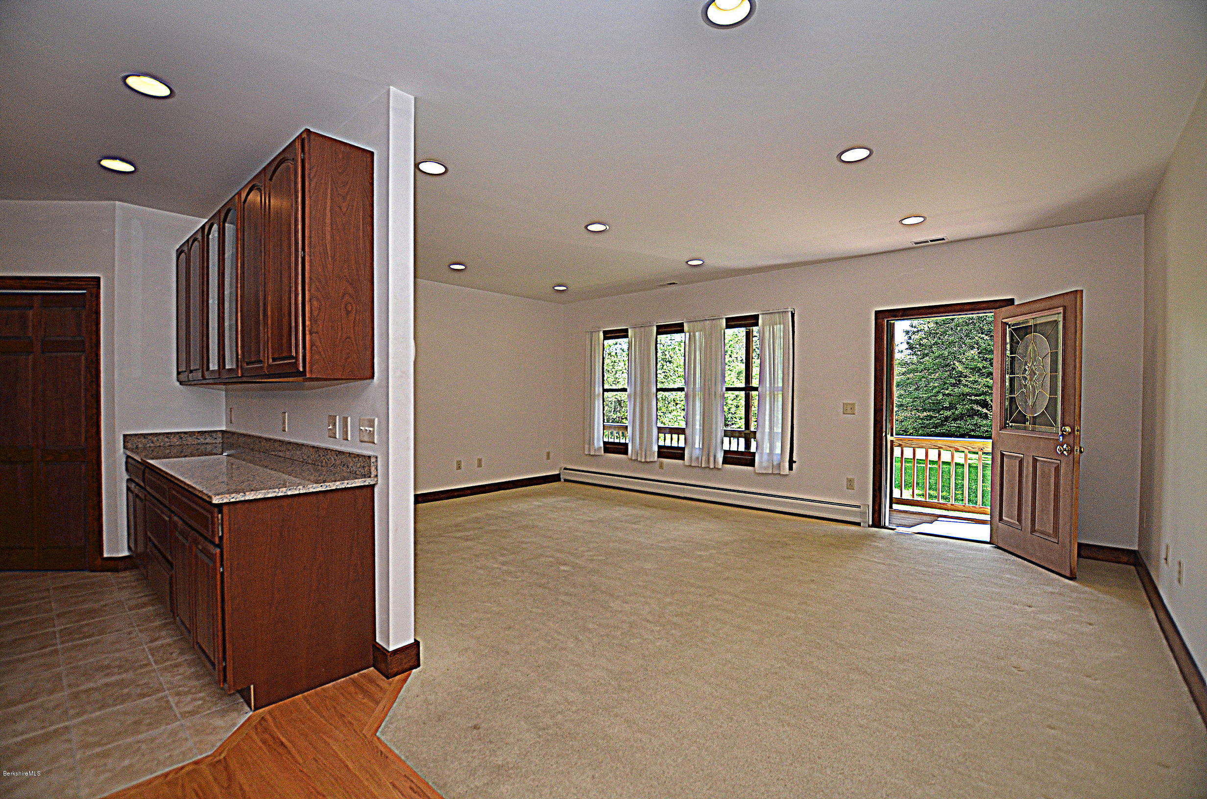779 Stebbins Road Otis, MA 01253 - Photo 13 of 40 a view of an empty room with window and cabinet