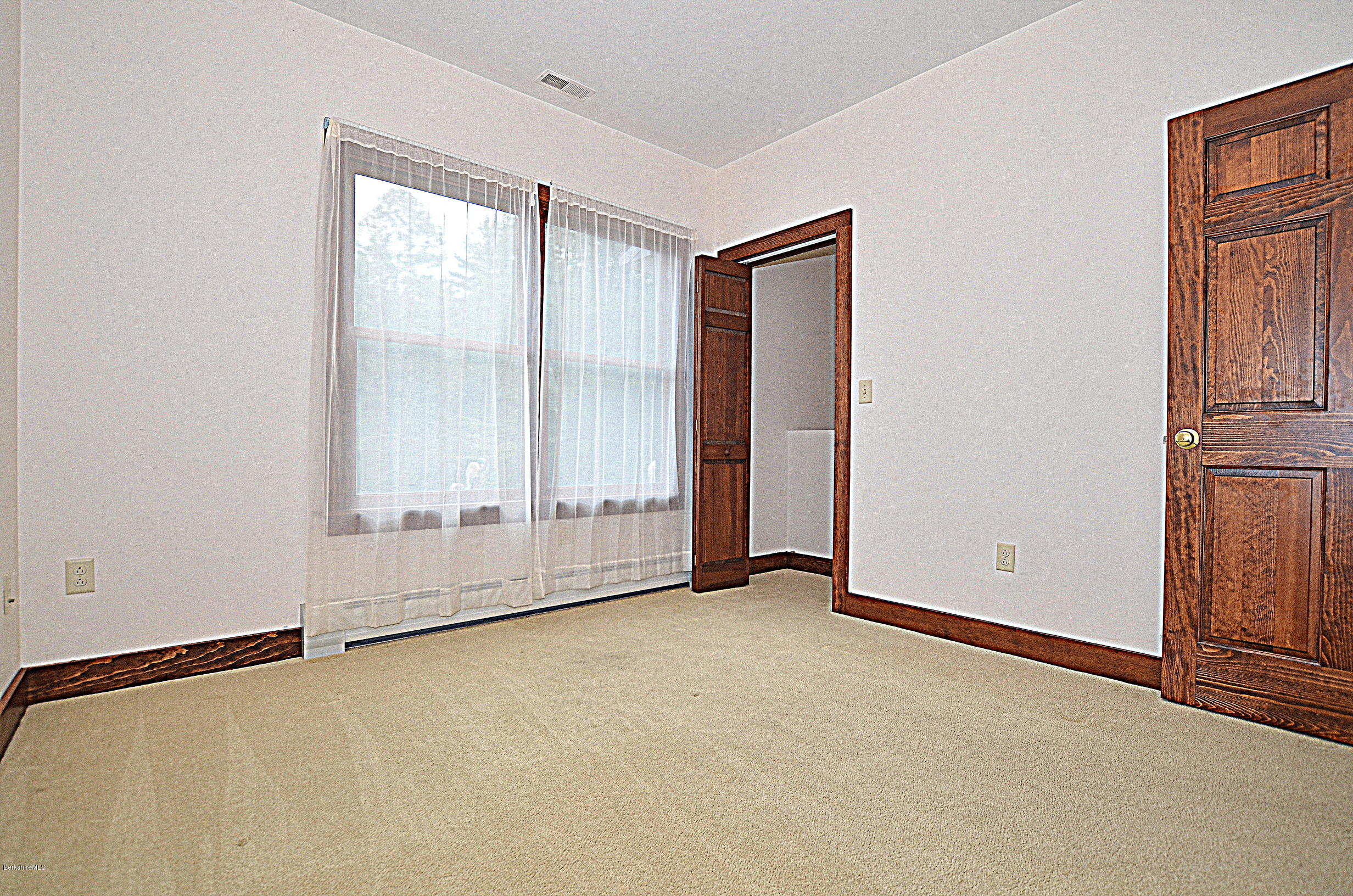 779 Stebbins Road Otis, MA 01253 - Photo 27 of 40 an empty room with windows