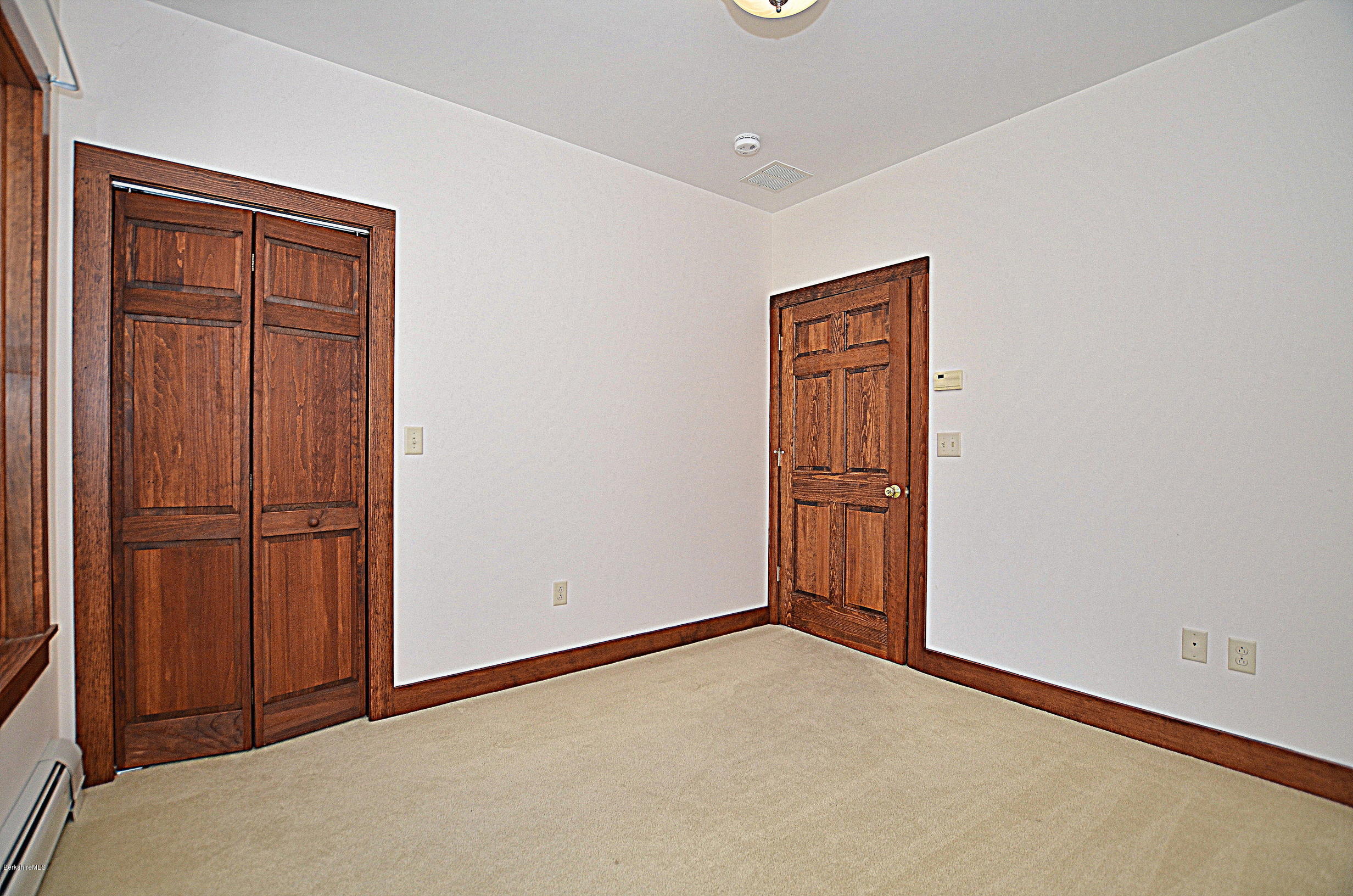 779 Stebbins Road Otis, MA 01253 - Photo 28 of 40 an empty room with closet area