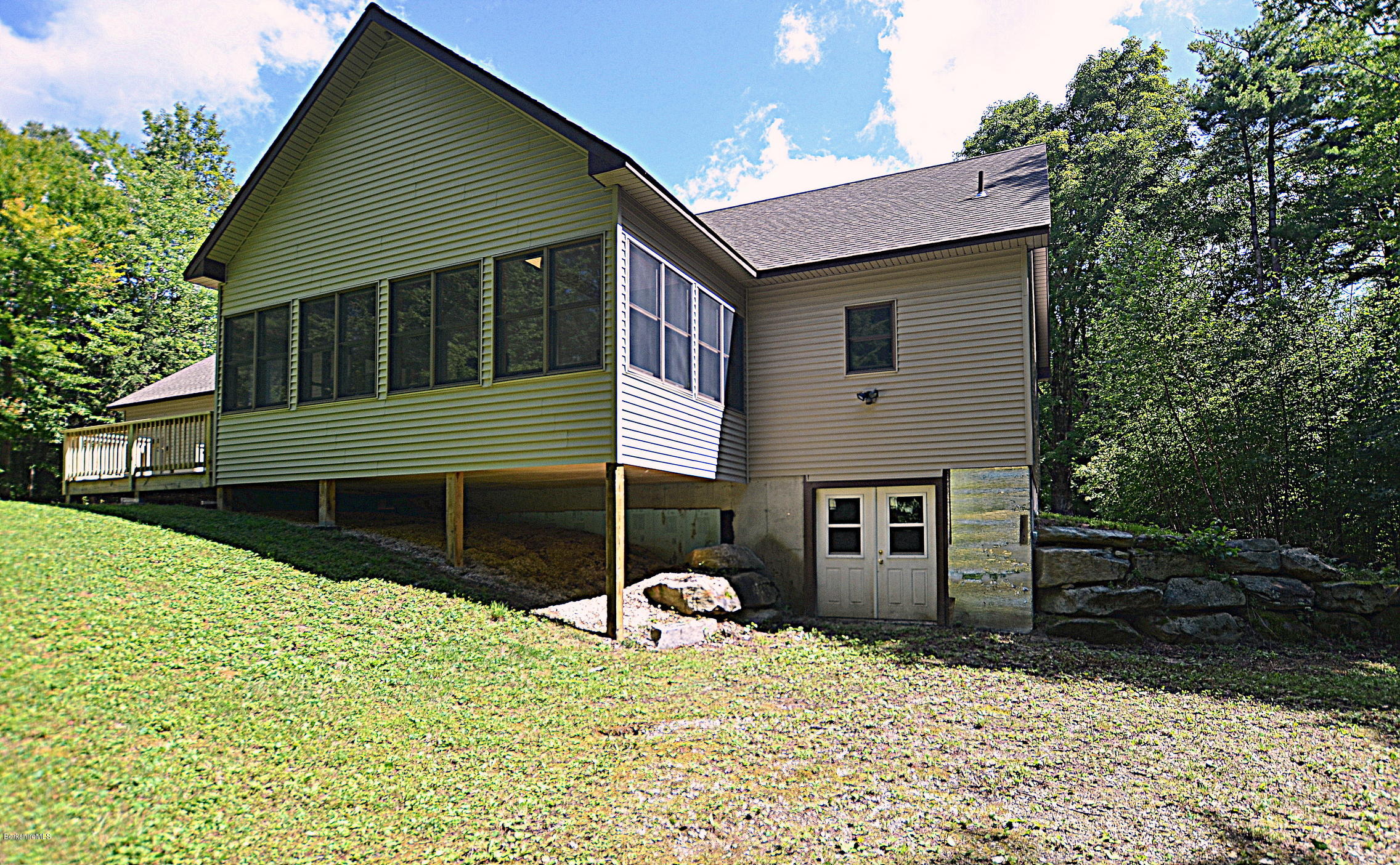 779 Stebbins Road Otis, MA 01253 - Photo 4 of 40 a view of a house with a yard