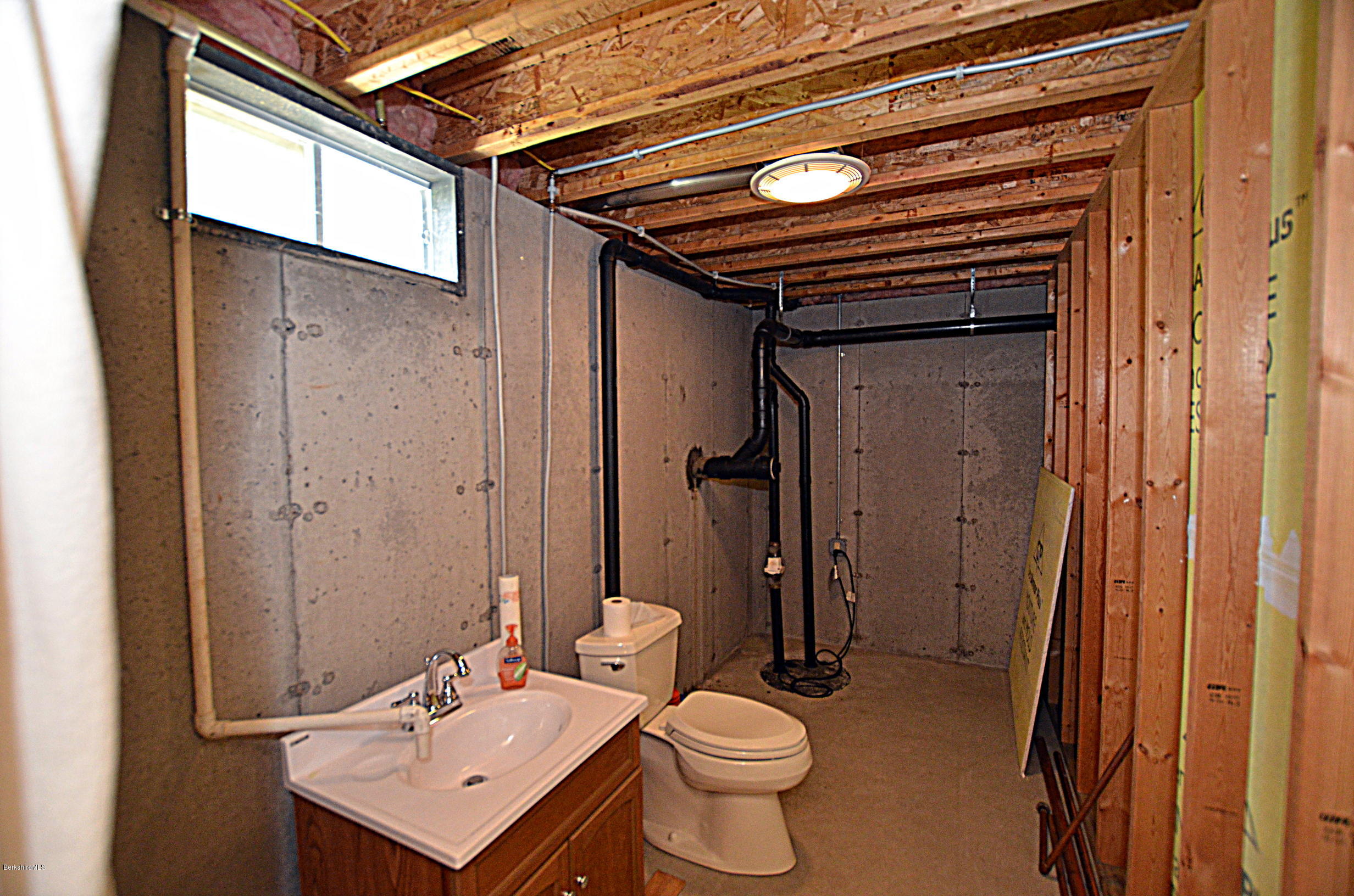 779 Stebbins Road Otis, MA 01253 - Photo 35 of 40 a bathroom with a sink a toilet and shower