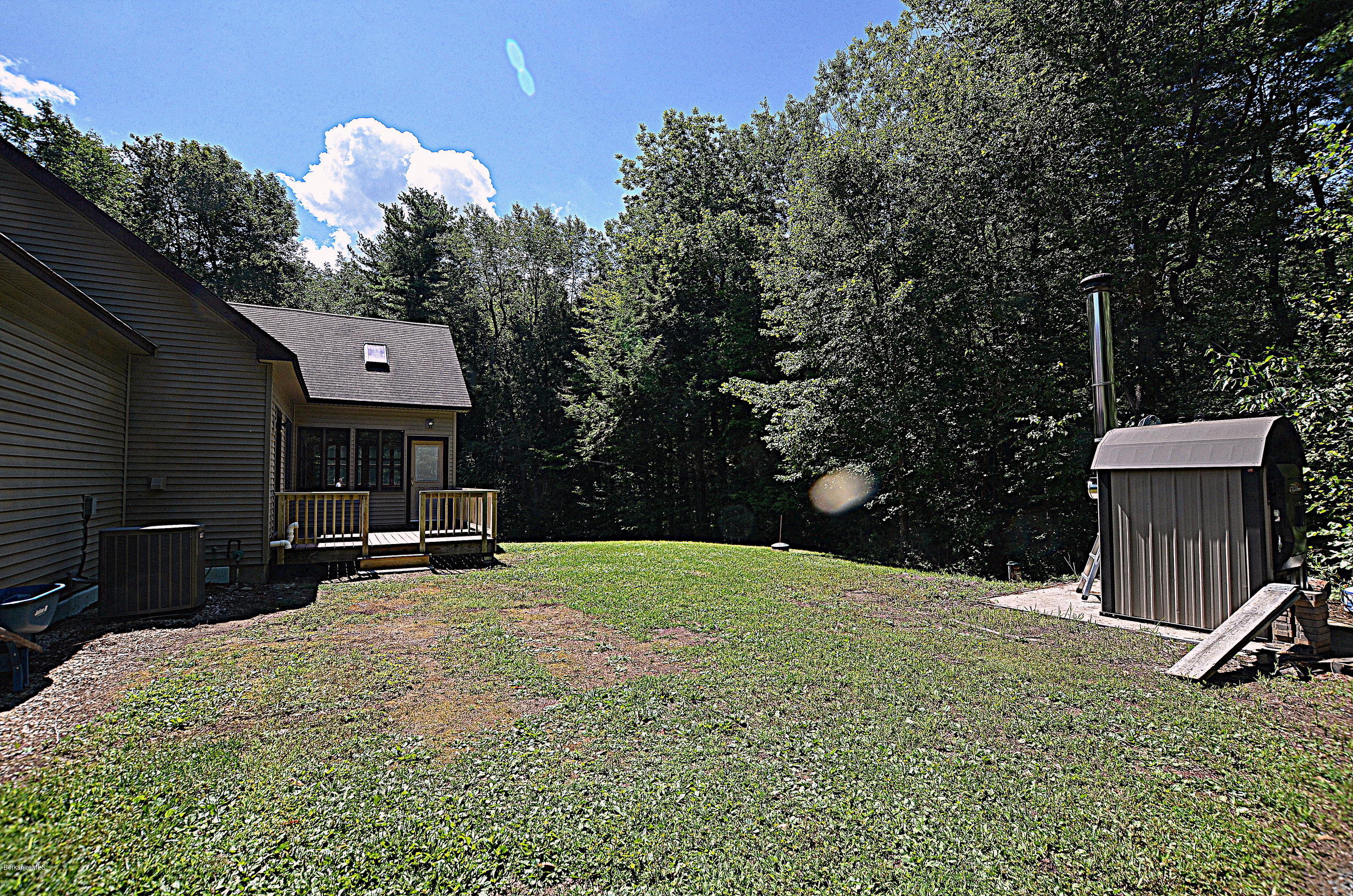 779 Stebbins Road Otis, MA 01253 - Photo 39 of 40 a view of a house with backyard and sitting area