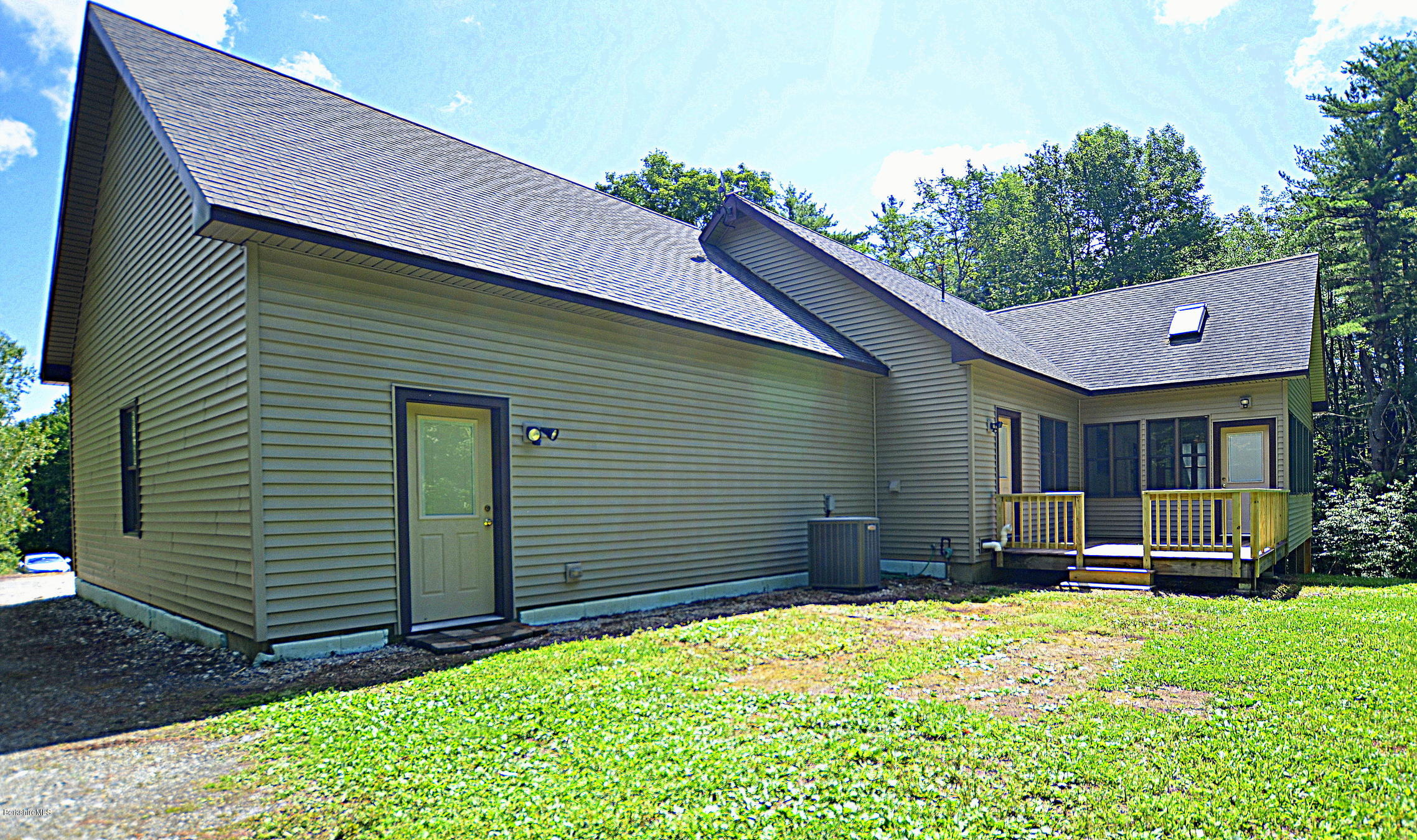 779 Stebbins Road Otis, MA 01253 - Photo 6 of 40 a backyard of a house with barbeque oven