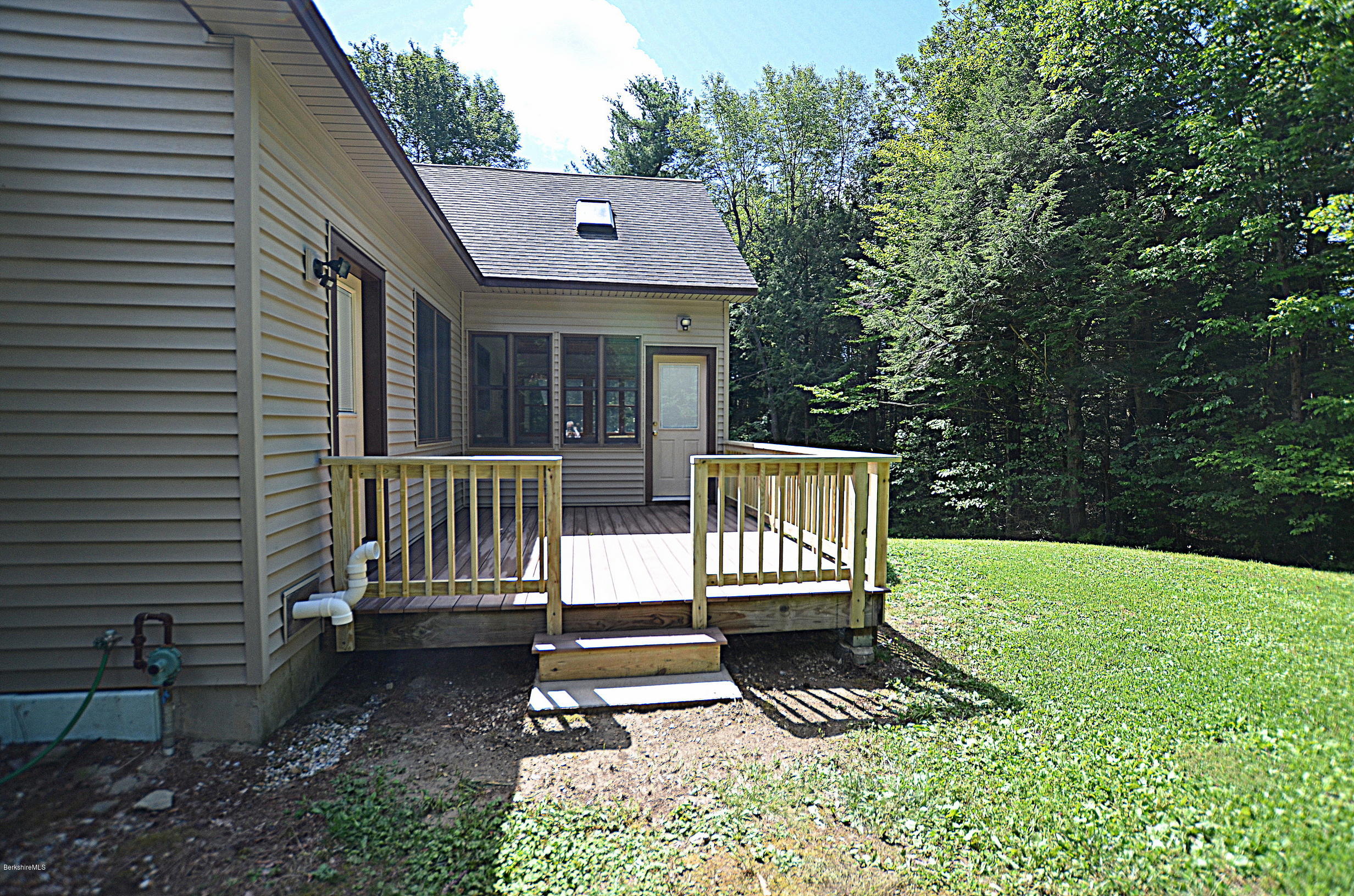 779 Stebbins Road Otis, MA 01253 - Photo 7 of 40 a view of a bench in the backyard