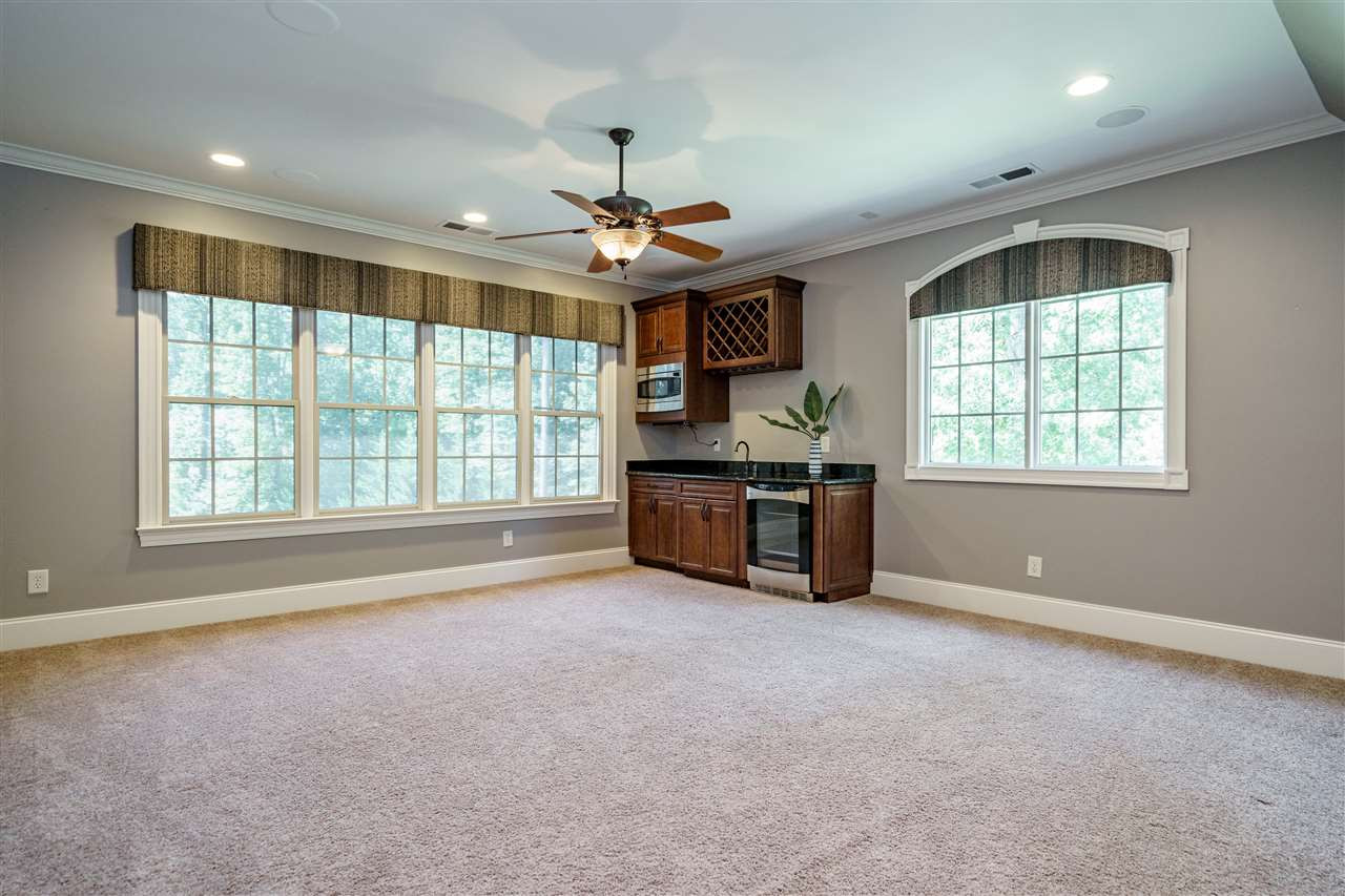 1448 Tacketts Pond Drive Raleigh, NC 27614 - Photo 24 of 30 Media room w/blackout shades & kitchenette