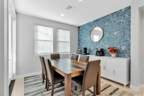 a view of a dining room with furniture and window
