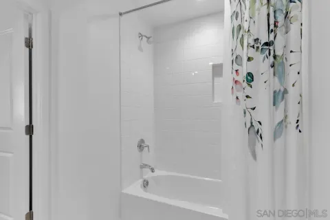 a bathroom with a shower curtain