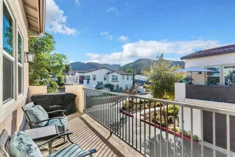 a view of a balcony with furniture