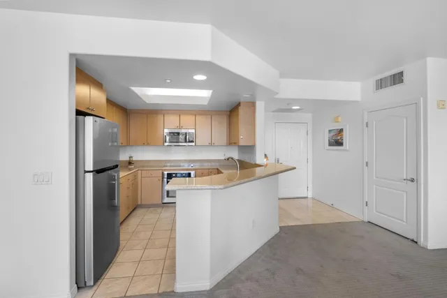 a kitchen with a sink stove and microwave