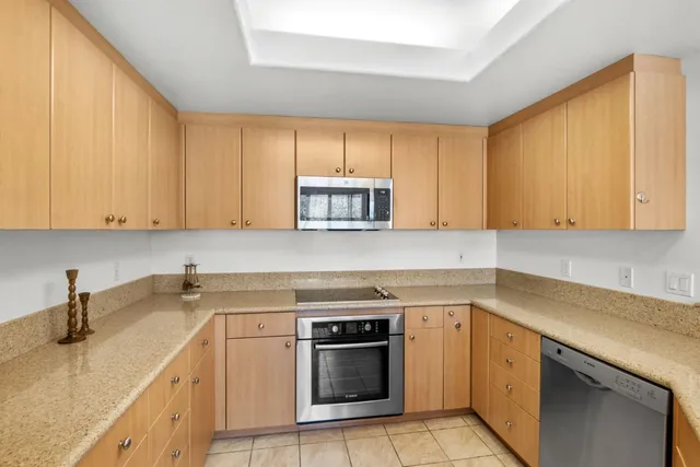 a kitchen with lots of counter top space and living room