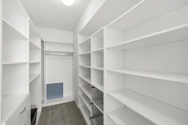 a bathroom with a sink a toilet and a large mirror