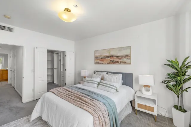 a view of a balcony with furniture and front door