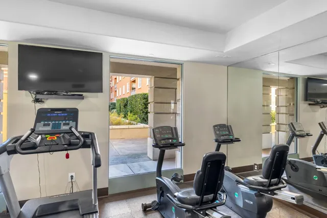 a view of parking garage with cars