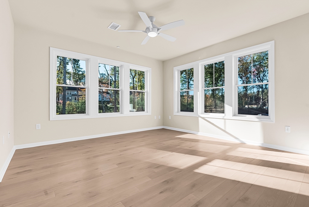 2 Winslow Lane, Unit 201 Grafton, MA 01536 - Photo 11 of 33 a view of an empty room with a window and balcony
