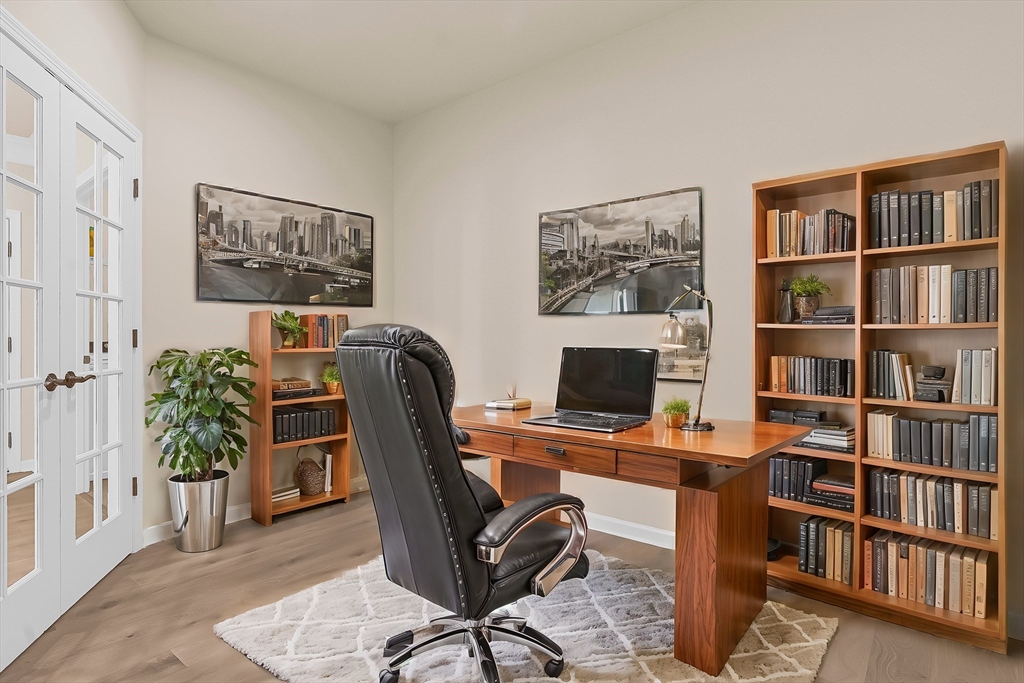 2 Winslow Lane, Unit 201 Grafton, MA 01536 - Photo 12 of 33 a view of a workspace with bookshelf and a window