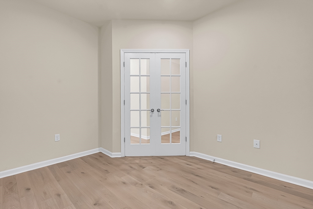 2 Winslow Lane, Unit 201 Grafton, MA 01536 - Photo 14 of 33 an empty room with wooden floor closet and windows