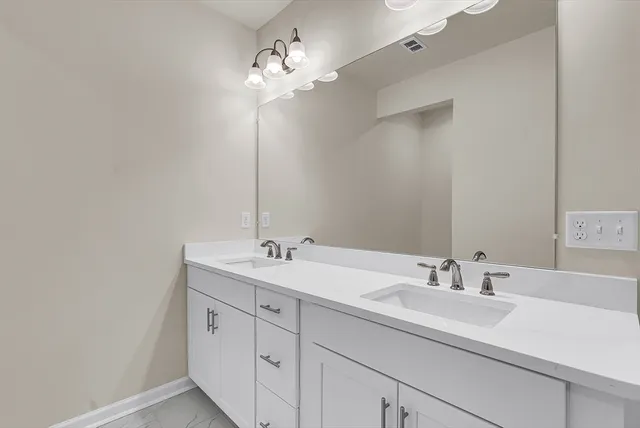 a bathroom with a shower sink and toilet