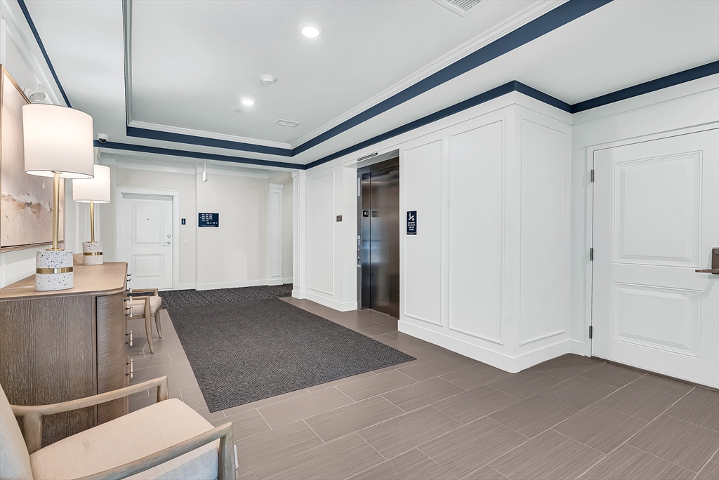 2 Winslow Lane, Unit 201 Grafton, MA 01536 - Photo 2 of 33 a view of a kitchen with wooden floor and a sink
