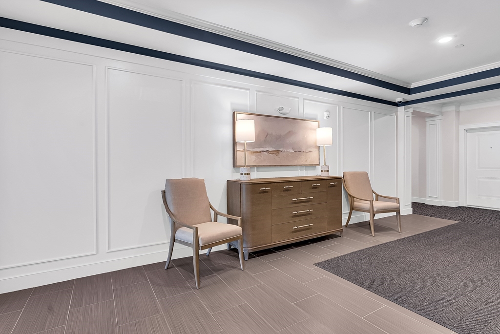 2 Winslow Lane, Unit 201 Grafton, MA 01536 - Photo 31 of 33 a room with furniture and a chair