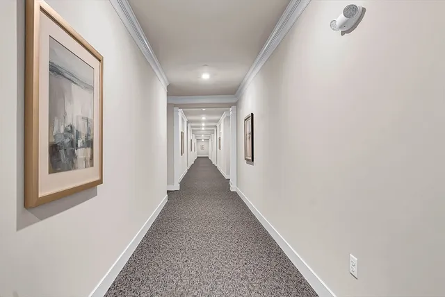 front view of a brick house with a large window