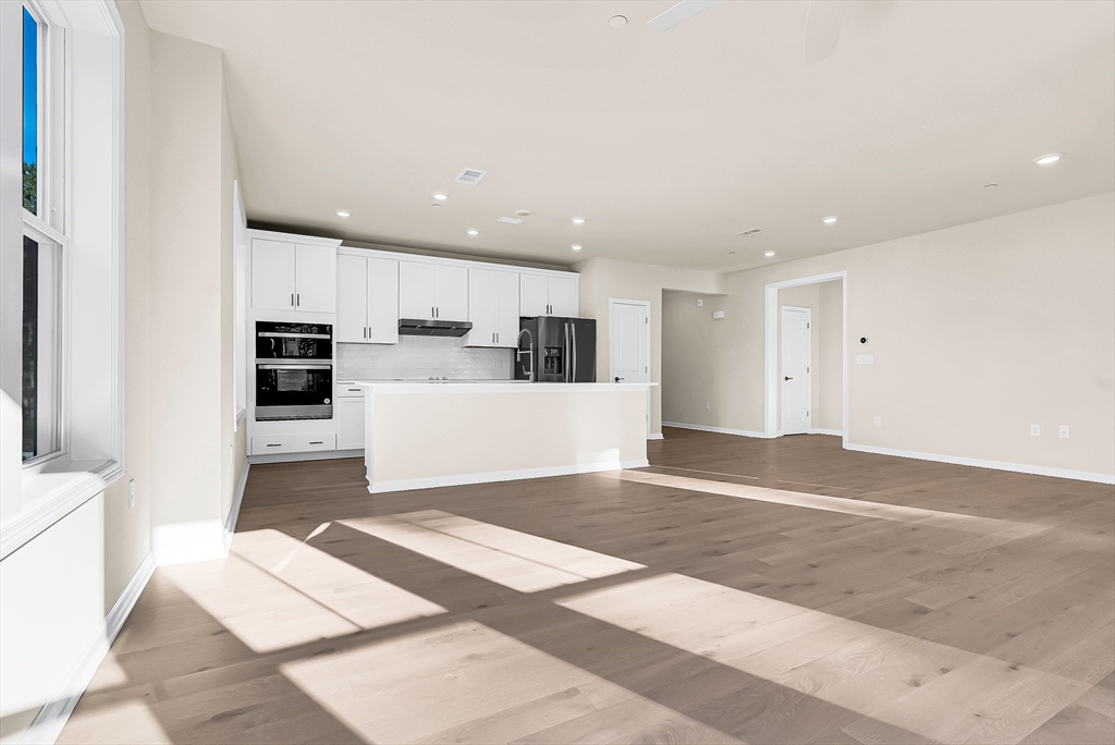 2 Winslow Lane, Unit 201 Grafton, MA 01536 - Photo 4 of 33 a view of a kitchen with microwave and cabinets