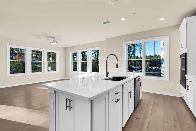 a view of a kitchen counter space and wooden floor