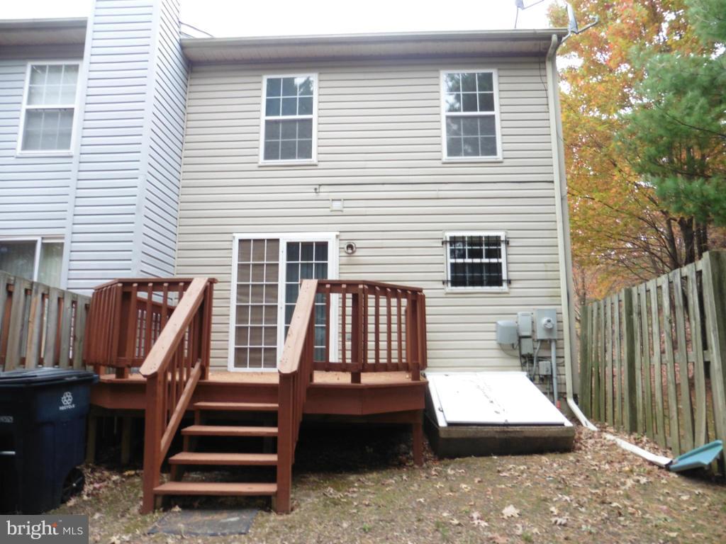 8817 Ritchboro Road District Heights, MD 20747 - Photo 2 of 19 a view of a patio with chairs and iron fence