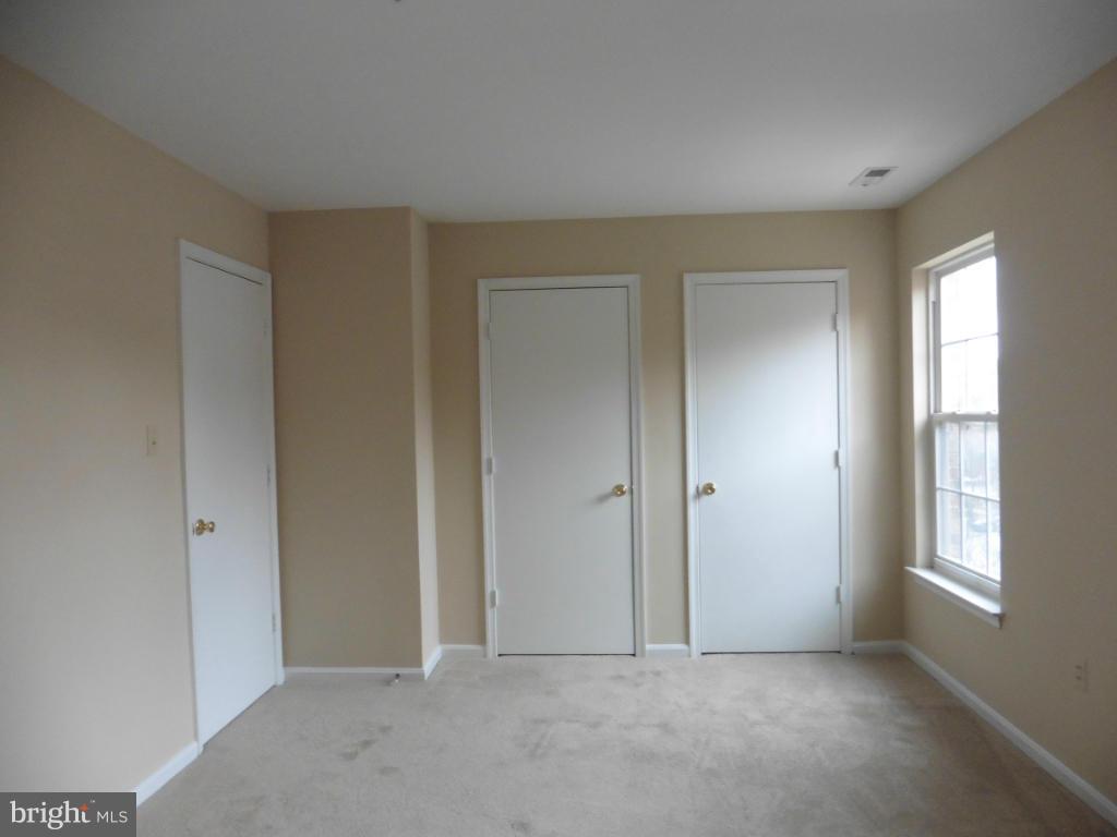 8817 Ritchboro Road District Heights, MD 20747 - Photo 11 of 19 a view of an empty room with windows and closet