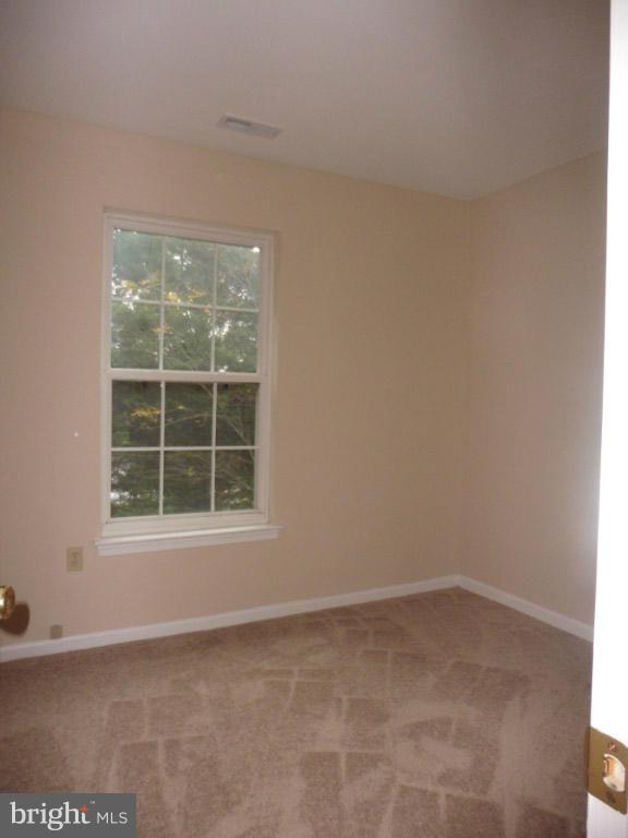 8817 Ritchboro Road District Heights, MD 20747 - Photo 14 of 19 an empty room with a window