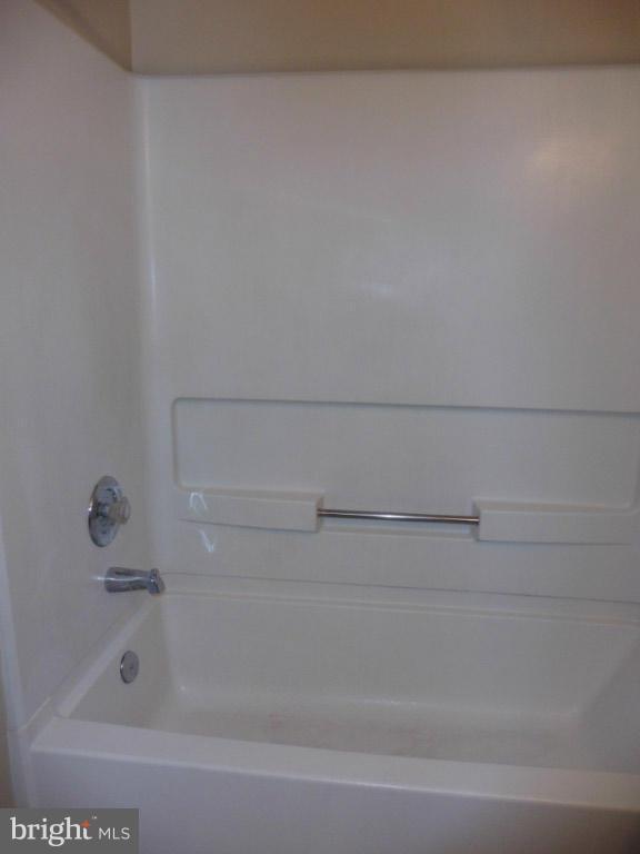 8817 Ritchboro Road District Heights, MD 20747 - Photo 17 of 19 a bathroom with a bathtub