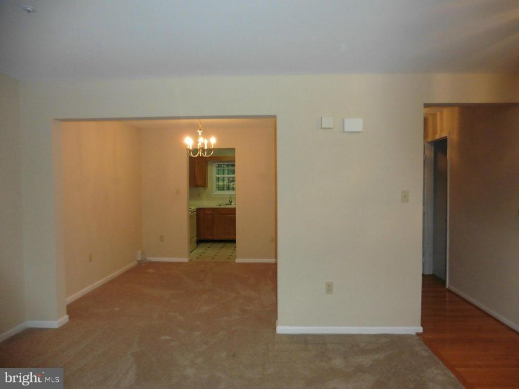 8817 Ritchboro Road District Heights, MD 20747 - Photo 5 of 19 a view of an empty room with a kitchen