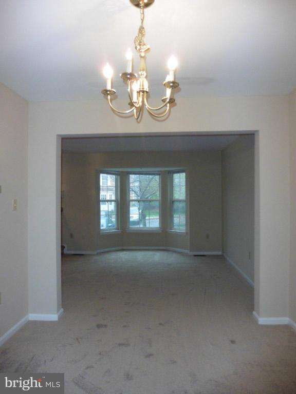 8817 Ritchboro Road District Heights, MD 20747 - Photo 6 of 19 a view of a room with a chandelier