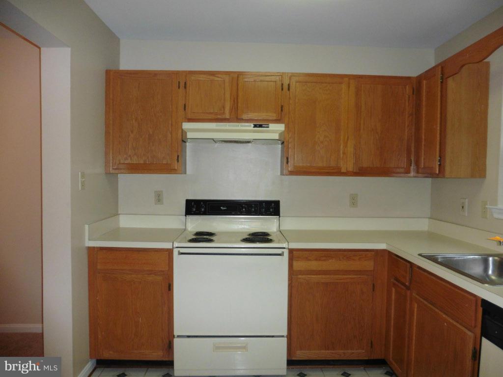 8817 Ritchboro Road District Heights, MD 20747 - Photo 8 of 19 a kitchen with a sink and cabinets