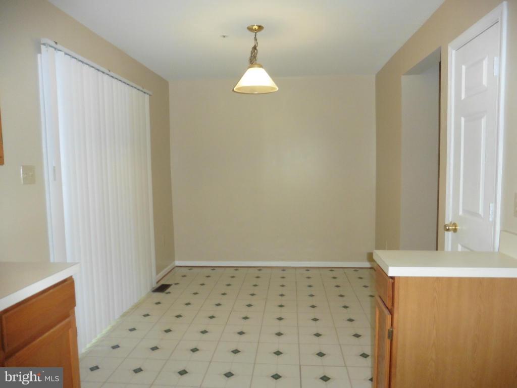 8817 Ritchboro Road District Heights, MD 20747 - Photo 10 of 19 a bathroom with a sink a mirror and shower