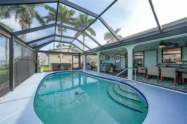 a view of a swimming pool with a patio