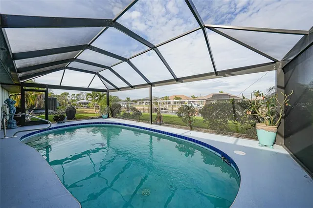 a view of a swimming pool with a porch