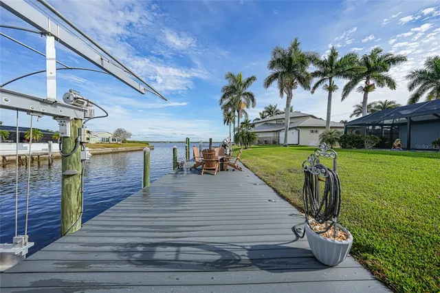 a view of a backyard with sitting area