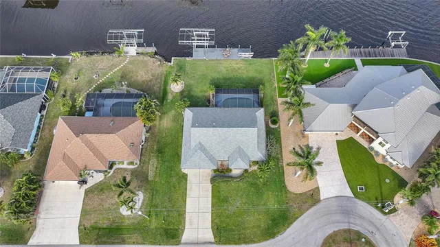 an aerial view of a house with a garden and plants