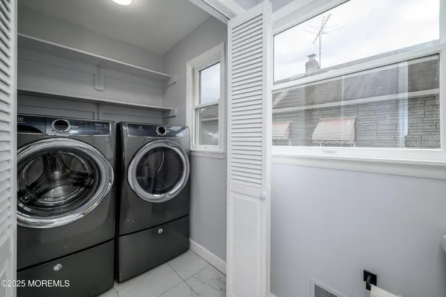 a utility room with dryer and washer