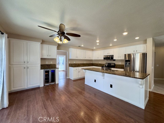 32948 Levi Court Temecula, CA 92592 - Photo 13 of 59 a large kitchen with stainless steel appliances kitchen island granite countertop a refrigerator a stove a sink and a oven