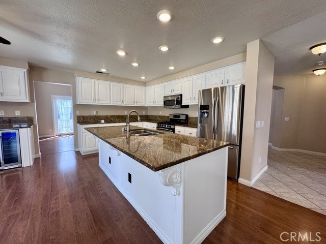 32948 Levi Court Temecula, CA 92592 - Photo 14 of 59 a kitchen with stainless steel appliances granite countertop a sink a refrigerator and a stove top oven