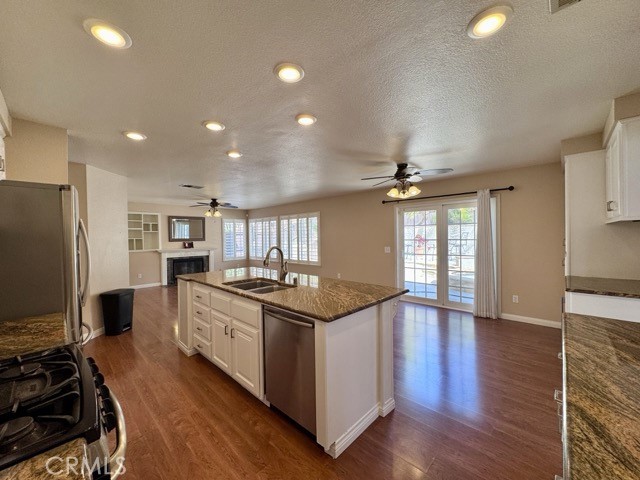 32948 Levi Court Temecula, CA 92592 - Photo 17 of 59 a kitchen with stainless steel appliances granite countertop a stove and a refrigerator