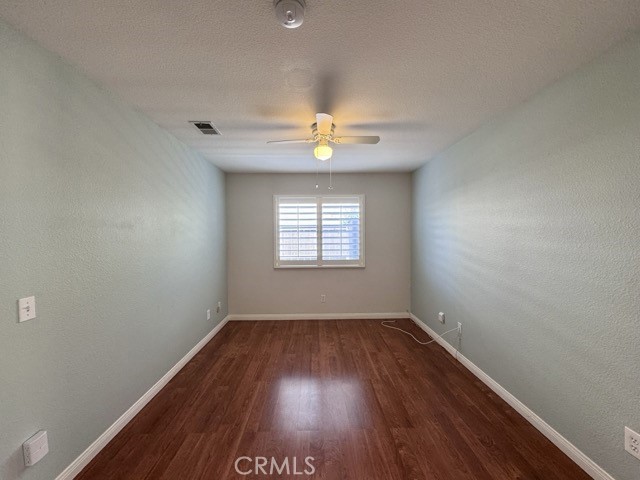 32948 Levi Court Temecula, CA 92592 - Photo 22 of 59 an empty room with a window and a ceiling fan