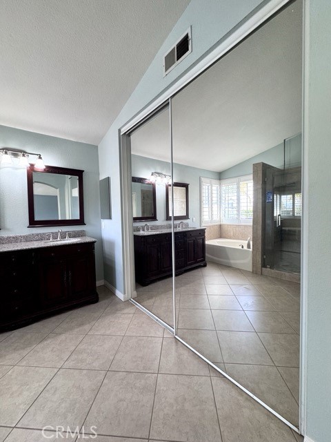 32948 Levi Court Temecula, CA 92592 - Photo 44 of 59 a kitchen with granite countertop a refrigerator and a sink