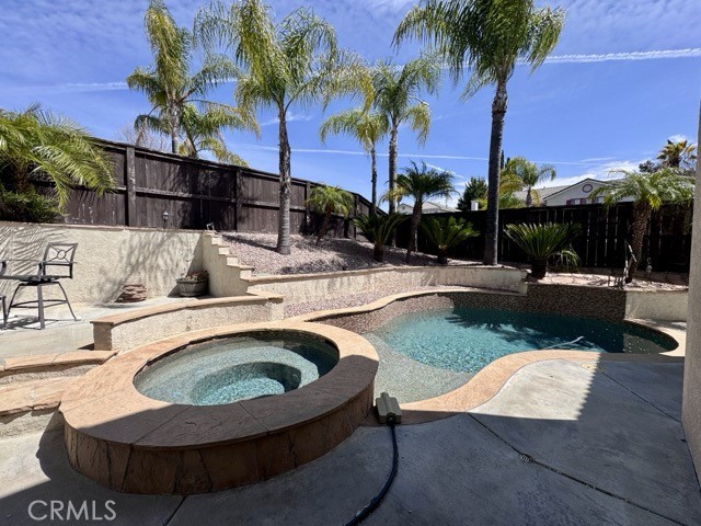 32948 Levi Court Temecula, CA 92592 - Photo 49 of 59 a view of swimming pool with outdoor seating and palm tree