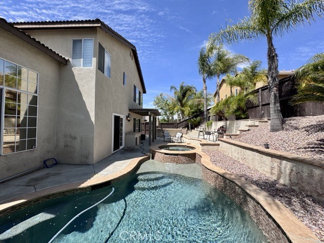 32948 Levi Court Temecula, CA 92592 - Photo 56 of 59 a wooden bench sitting in front of a house