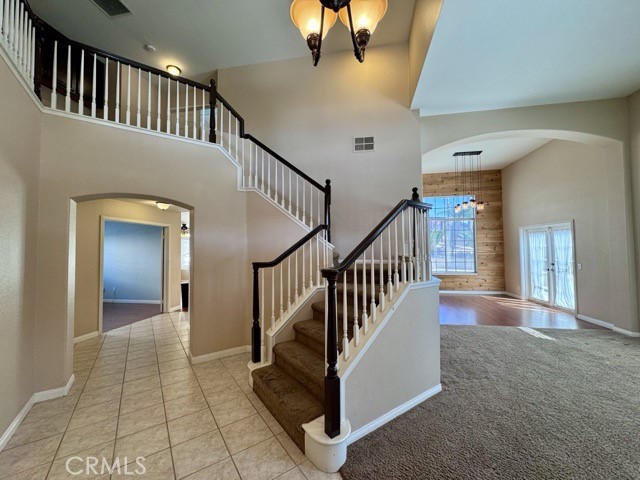 32948 Levi Court Temecula, CA 92592 - Photo 6 of 59 a view interior of a house with stairs and a floor to ceiling window