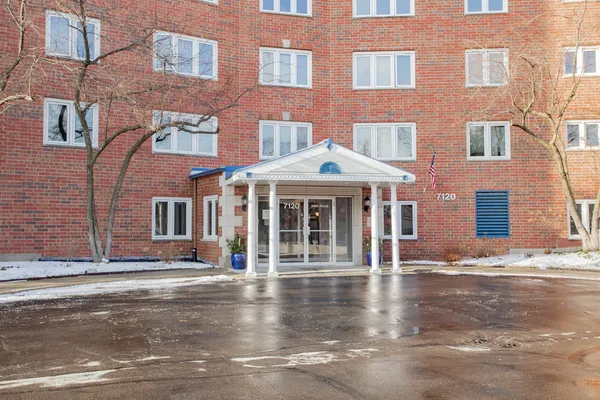 a front view of a building with street view