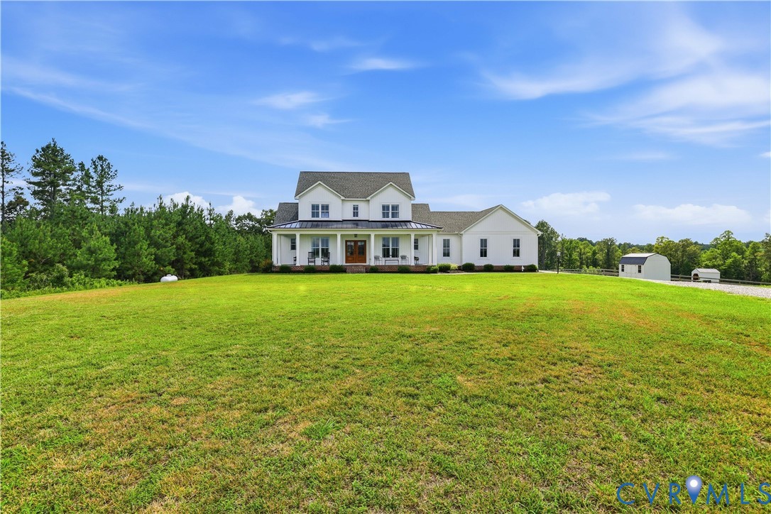 25181 West Soap Stone Road Jetersville, VA 23083 - Photo 4 of 54 White two-story residence featuring a covered fron